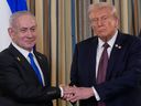 Israeli Prime Minister Benjamin Netanyahu, left, shakes hands with President Donald Trump, in the White House in Washington, D.C., on Sept. 29.